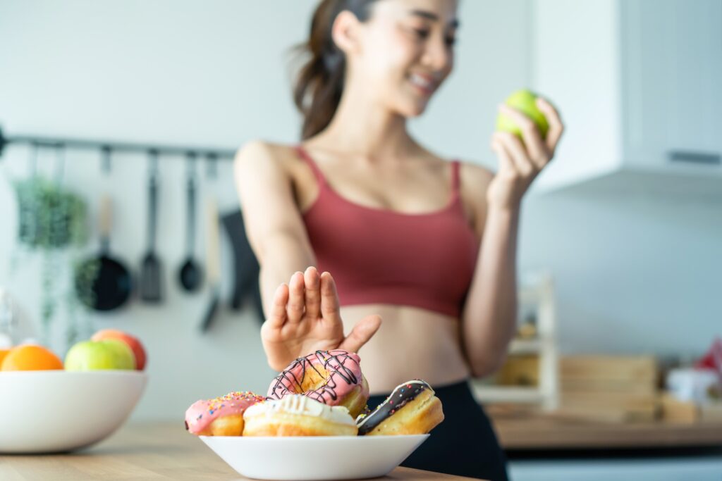 asian attractive active woman pick up a green appl 2025 04 01 04 46 55 utc